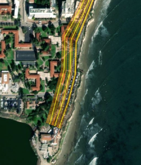 top-down image of buildings a cliff and ocean